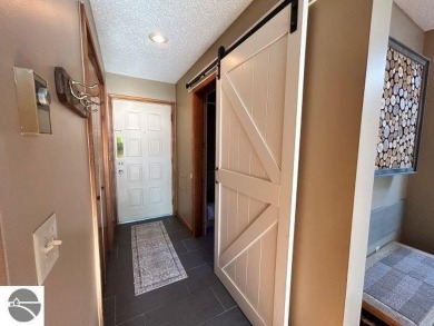This exceptional three-bedroom, three-and-a-half bathroom condo on Shanty Creek Golf Course in Michigan - for sale on GolfHomes.com, golf home, golf lot