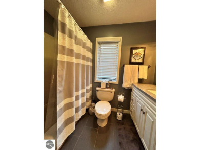 This exceptional three-bedroom, three-and-a-half bathroom condo on Shanty Creek Golf Course in Michigan - for sale on GolfHomes.com, golf home, golf lot