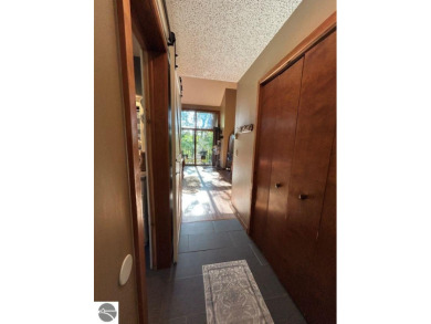 This exceptional three-bedroom, three-and-a-half bathroom condo on Shanty Creek Golf Course in Michigan - for sale on GolfHomes.com, golf home, golf lot