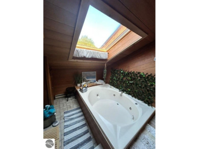 This exceptional three-bedroom, three-and-a-half bathroom condo on Shanty Creek Golf Course in Michigan - for sale on GolfHomes.com, golf home, golf lot