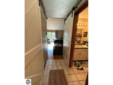 This exceptional three-bedroom, three-and-a-half bathroom condo on Shanty Creek Golf Course in Michigan - for sale on GolfHomes.com, golf home, golf lot