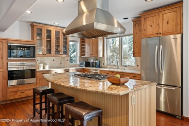 Tucked away off of Cemetery Lane, this cozy home backs up to the on Aspen Golf Club in Colorado - for sale on GolfHomes.com, golf home, golf lot