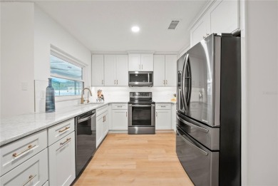 Experience waterfront luxury living in this fully renovated on Bloomingdale Golfers Club in Florida - for sale on GolfHomes.com, golf home, golf lot