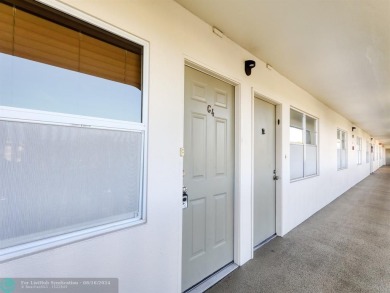 ALL IMPACT WINDOWS, PATIO  FRONT DOOR. OPEN KITCHEN REAL WOOD on Wynmoor Golf Course in Florida - for sale on GolfHomes.com, golf home, golf lot