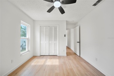 Experience waterfront luxury living in this fully renovated on Bloomingdale Golfers Club in Florida - for sale on GolfHomes.com, golf home, golf lot
