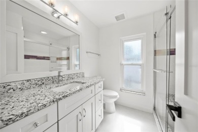 Experience waterfront luxury living in this fully renovated on Bloomingdale Golfers Club in Florida - for sale on GolfHomes.com, golf home, golf lot