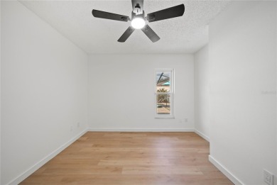 Experience waterfront luxury living in this fully renovated on Bloomingdale Golfers Club in Florida - for sale on GolfHomes.com, golf home, golf lot