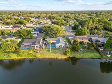 Experience waterfront luxury living in this fully renovated on Bloomingdale Golfers Club in Florida - for sale on GolfHomes.com, golf home, golf lot