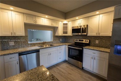 Spacious 2 bedroom 2 bath with large ENCLOSED BALCONY , storage on Flamingo Lakes Country Club in Florida - for sale on GolfHomes.com, golf home, golf lot