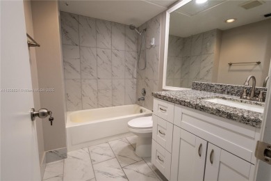 Spacious 2 bedroom 2 bath with large ENCLOSED BALCONY , storage on Flamingo Lakes Country Club in Florida - for sale on GolfHomes.com, golf home, golf lot