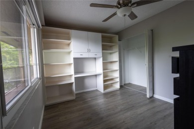 Spacious 2 bedroom 2 bath with large ENCLOSED BALCONY , storage on Flamingo Lakes Country Club in Florida - for sale on GolfHomes.com, golf home, golf lot