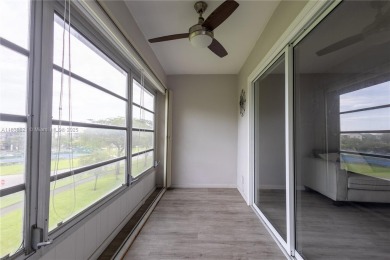 Spacious 2 bedroom 2 bath with large ENCLOSED BALCONY , storage on Flamingo Lakes Country Club in Florida - for sale on GolfHomes.com, golf home, golf lot