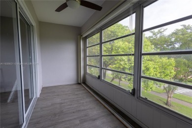 Spacious 2 bedroom 2 bath with large ENCLOSED BALCONY , storage on Flamingo Lakes Country Club in Florida - for sale on GolfHomes.com, golf home, golf lot