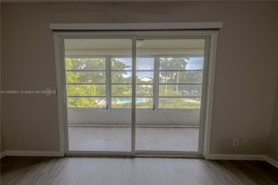 Spacious 2 bedroom 2 bath with large ENCLOSED BALCONY , storage on Flamingo Lakes Country Club in Florida - for sale on GolfHomes.com, golf home, golf lot