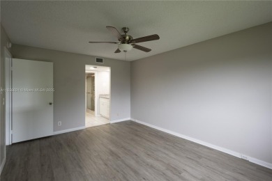 Spacious 2 bedroom 2 bath with large ENCLOSED BALCONY , storage on Flamingo Lakes Country Club in Florida - for sale on GolfHomes.com, golf home, golf lot