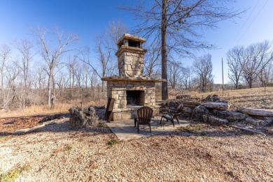 Located just 1.8 miles from the pristine waters of Bull Shoals on Lost Woods Golf Course in Missouri - for sale on GolfHomes.com, golf home, golf lot