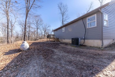 Located just 1.8 miles from the pristine waters of Bull Shoals on Lost Woods Golf Course in Missouri - for sale on GolfHomes.com, golf home, golf lot