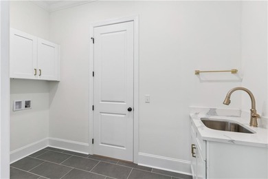 This thoughtfully designed home offers the ease of one-level on Oak Grove Island Golf and Country Club in Georgia - for sale on GolfHomes.com, golf home, golf lot