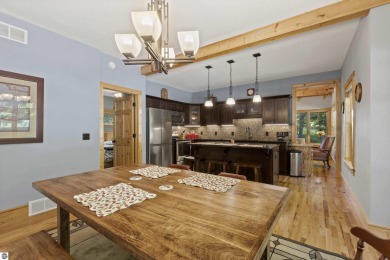 Experience year-round comfort and elegance in this like-new on Crystal Mountain Golf Course in Michigan - for sale on GolfHomes.com, golf home, golf lot
