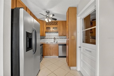 Spacious 2BR + Den + Office in 55+ Triplex - Middle Unit with on Sandpiper Golf Club in Florida - for sale on GolfHomes.com, golf home, golf lot