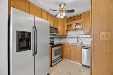 Spacious 2BR + Den + Office in 55+ Triplex - Middle Unit with on Sandpiper Golf Club in Florida - for sale on GolfHomes.com, golf home, golf lot