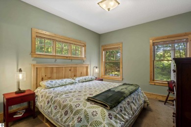 Experience year-round comfort and elegance in this like-new on Crystal Mountain Golf Course in Michigan - for sale on GolfHomes.com, golf home, golf lot