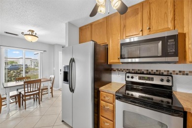 Spacious 2BR + Den + Office in 55+ Triplex - Middle Unit with on Sandpiper Golf Club in Florida - for sale on GolfHomes.com, golf home, golf lot
