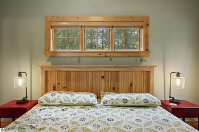 Experience year-round comfort and elegance in this like-new on Crystal Mountain Golf Course in Michigan - for sale on GolfHomes.com, golf home, golf lot