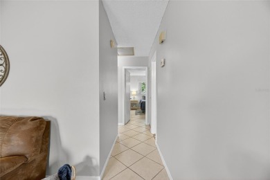 Spacious 2BR + Den + Office in 55+ Triplex - Middle Unit with on Sandpiper Golf Club in Florida - for sale on GolfHomes.com, golf home, golf lot