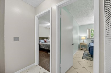 Spacious 2BR + Den + Office in 55+ Triplex - Middle Unit with on Sandpiper Golf Club in Florida - for sale on GolfHomes.com, golf home, golf lot