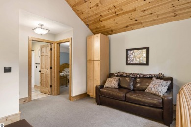 Experience year-round comfort and elegance in this like-new on Crystal Mountain Golf Course in Michigan - for sale on GolfHomes.com, golf home, golf lot