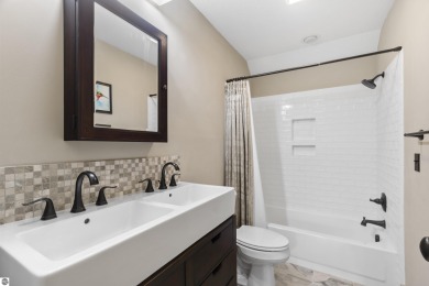 Experience year-round comfort and elegance in this like-new on Crystal Mountain Golf Course in Michigan - for sale on GolfHomes.com, golf home, golf lot