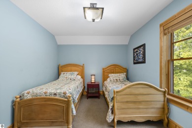 Experience year-round comfort and elegance in this like-new on Crystal Mountain Golf Course in Michigan - for sale on GolfHomes.com, golf home, golf lot