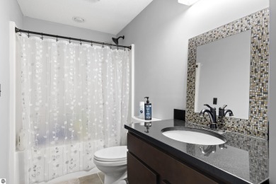 Experience year-round comfort and elegance in this like-new on Crystal Mountain Golf Course in Michigan - for sale on GolfHomes.com, golf home, golf lot