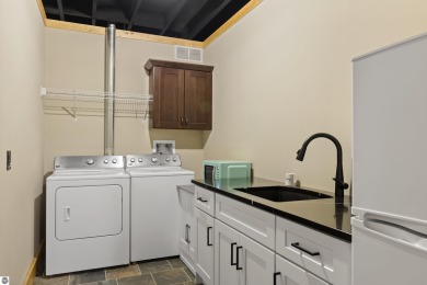 Experience year-round comfort and elegance in this like-new on Crystal Mountain Golf Course in Michigan - for sale on GolfHomes.com, golf home, golf lot