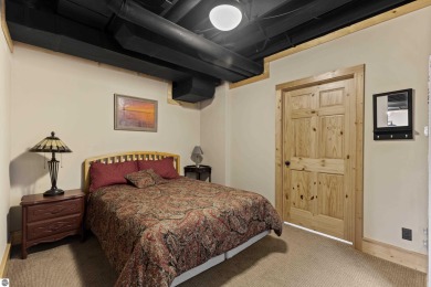 Experience year-round comfort and elegance in this like-new on Crystal Mountain Golf Course in Michigan - for sale on GolfHomes.com, golf home, golf lot