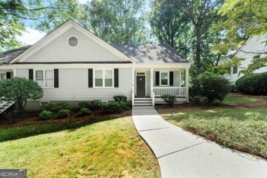 Welcome to this charming cottage nestled in the sought-after on Great Waters Course At Reynolds Plantation in Georgia - for sale on GolfHomes.com, golf home, golf lot