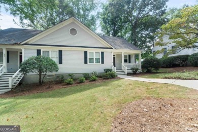 Welcome to this charming cottage nestled in the sought-after on Great Waters Course At Reynolds Plantation in Georgia - for sale on GolfHomes.com, golf home, golf lot