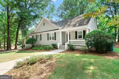 Welcome to this charming cottage nestled in the sought-after on Great Waters Course At Reynolds Plantation in Georgia - for sale on GolfHomes.com, golf home, golf lot