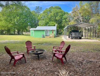 Living in Starke, Florida offers a blend of small-town charm on Starke Golf and Country Club in Florida - for sale on GolfHomes.com, golf home, golf lot