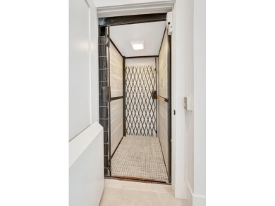 Arrive in style via your private elevator to a residence that on Boca Delray Golf and Country Club in Florida - for sale on GolfHomes.com, golf home, golf lot