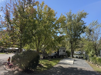 Beautifully landscaped LAKEFRONT RV lot in the sought after on Bent Creek Golf Course in Tennessee - for sale on GolfHomes.com, golf home, golf lot