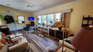 TWO BEDROOM, 1 1/2 BATHROOM MOBILE HOME IN ACTIVE 55+ COMMUNITY on River Run Golf Links in Florida - for sale on GolfHomes.com, golf home, golf lot
