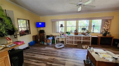 TWO BEDROOM, 1 1/2 BATHROOM MOBILE HOME IN ACTIVE 55+ COMMUNITY on River Run Golf Links in Florida - for sale on GolfHomes.com, golf home, golf lot