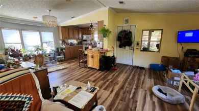 TWO BEDROOM, 1 1/2 BATHROOM MOBILE HOME IN ACTIVE 55+ COMMUNITY on River Run Golf Links in Florida - for sale on GolfHomes.com, golf home, golf lot