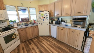 TWO BEDROOM, 1 1/2 BATHROOM MOBILE HOME IN ACTIVE 55+ COMMUNITY on River Run Golf Links in Florida - for sale on GolfHomes.com, golf home, golf lot