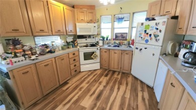 TWO BEDROOM, 1 1/2 BATHROOM MOBILE HOME IN ACTIVE 55+ COMMUNITY on River Run Golf Links in Florida - for sale on GolfHomes.com, golf home, golf lot