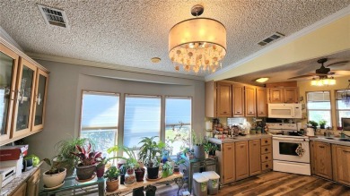 TWO BEDROOM, 1 1/2 BATHROOM MOBILE HOME IN ACTIVE 55+ COMMUNITY on River Run Golf Links in Florida - for sale on GolfHomes.com, golf home, golf lot