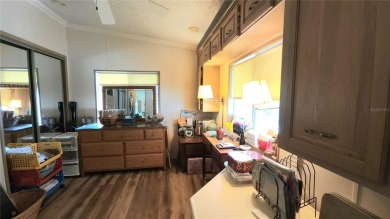 TWO BEDROOM, 1 1/2 BATHROOM MOBILE HOME IN ACTIVE 55+ COMMUNITY on River Run Golf Links in Florida - for sale on GolfHomes.com, golf home, golf lot