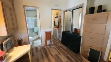 TWO BEDROOM, 1 1/2 BATHROOM MOBILE HOME IN ACTIVE 55+ COMMUNITY on River Run Golf Links in Florida - for sale on GolfHomes.com, golf home, golf lot
